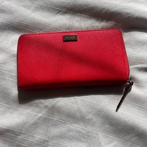Red Kate Spade wallet in EXCELLENT condition.